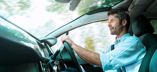 Man driving a car.
