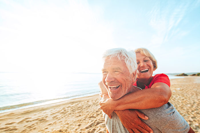 Senior couple having fun at the beach on a nice day