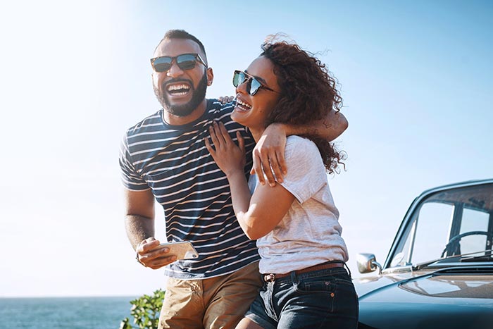 Young couple enjoying a summer road trip together