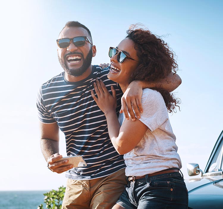Young couple enjoying a summer road trip together