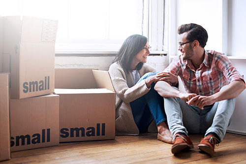 Young couple moving into new house