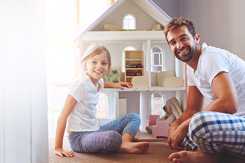 Father and his daughter at home