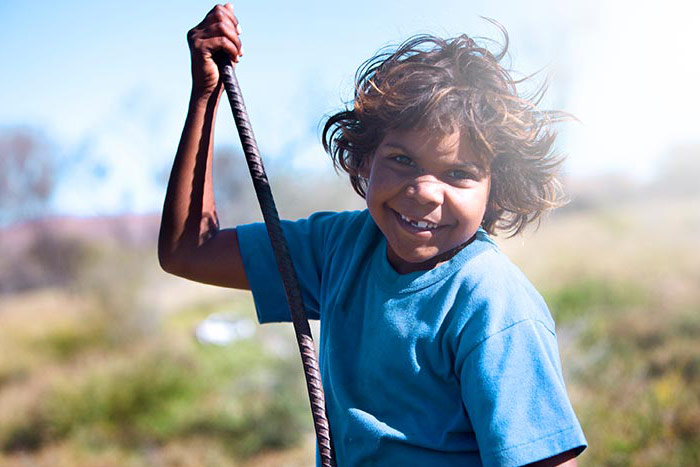 A happy indigenous girl living in outback australia