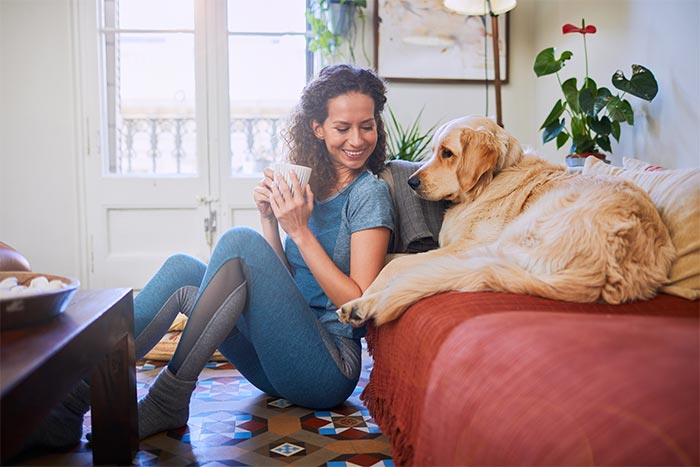 Woman at home with her dog
