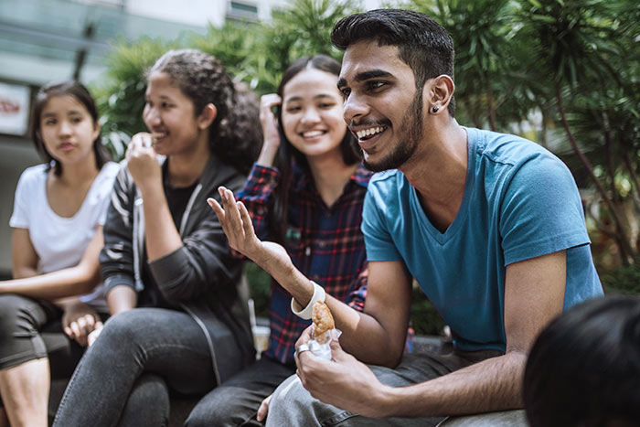 Group Of Students Joking And Getting To Know Each Other