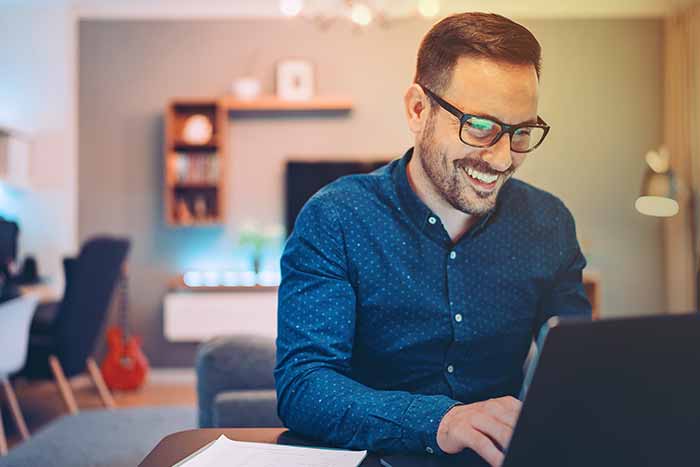 Young man working at home in the evening