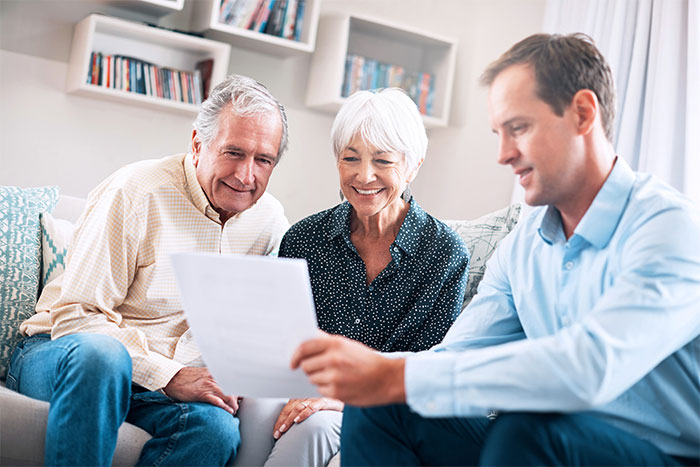 Senior couple getting advice from a financial planner