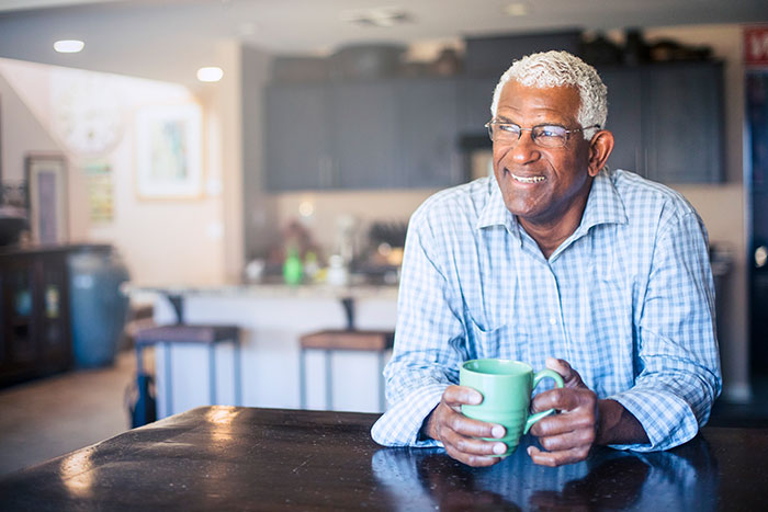 Senior african american man enjoying a cup of coffee at home