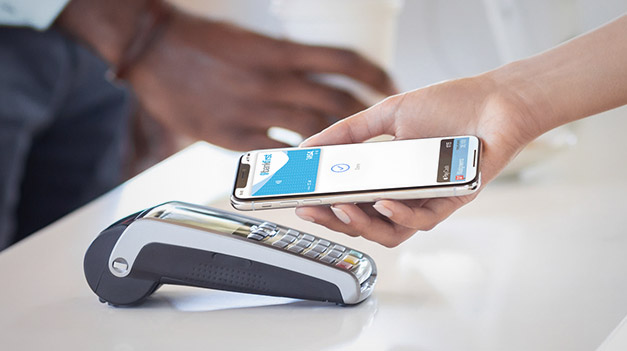 Person using Apple Pay with Snow Star Credit Union card