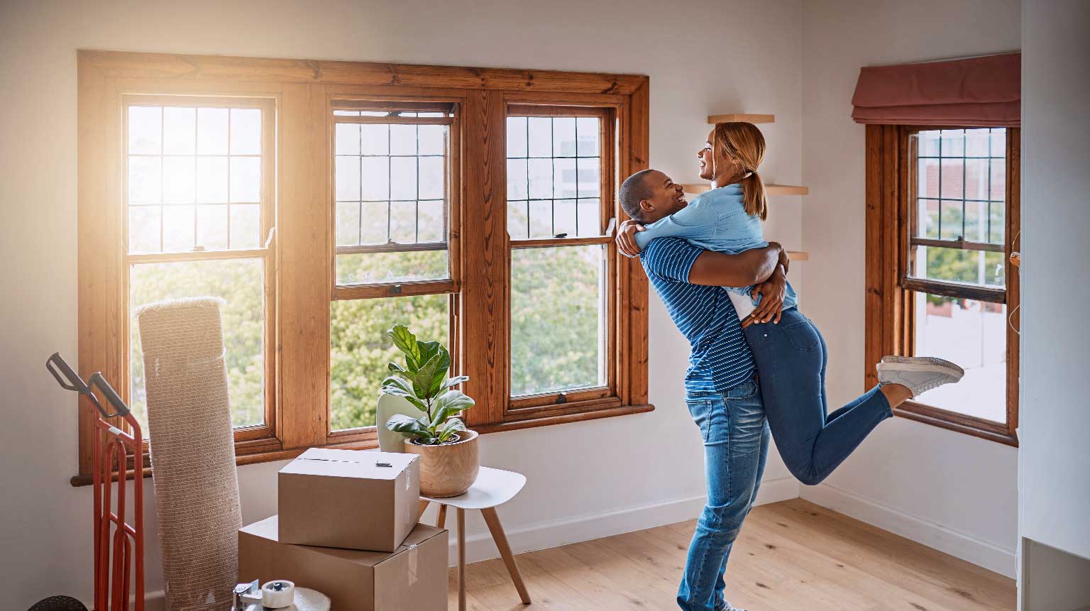 Loving young couple celebrating their new home