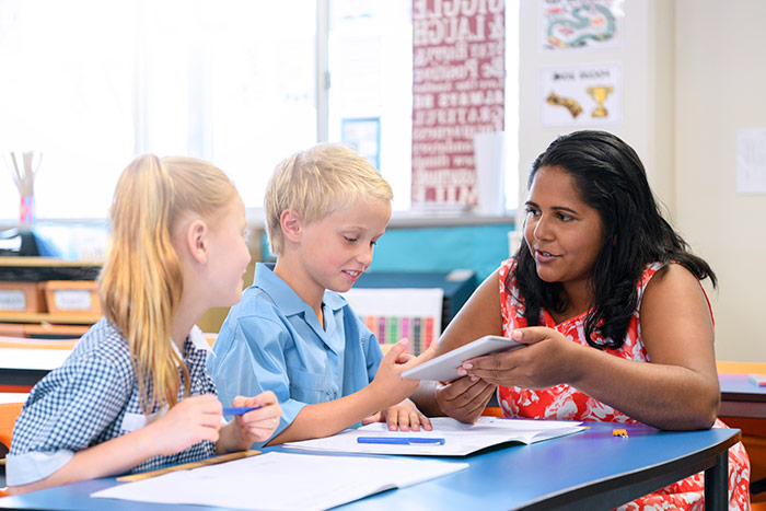 Teacher is teaching kids 