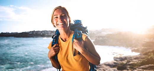 Blond girl with backpack at her back