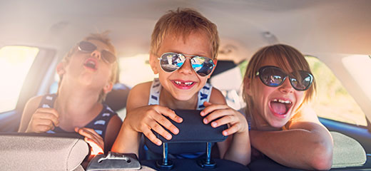 Kids having fun in car on a road trip