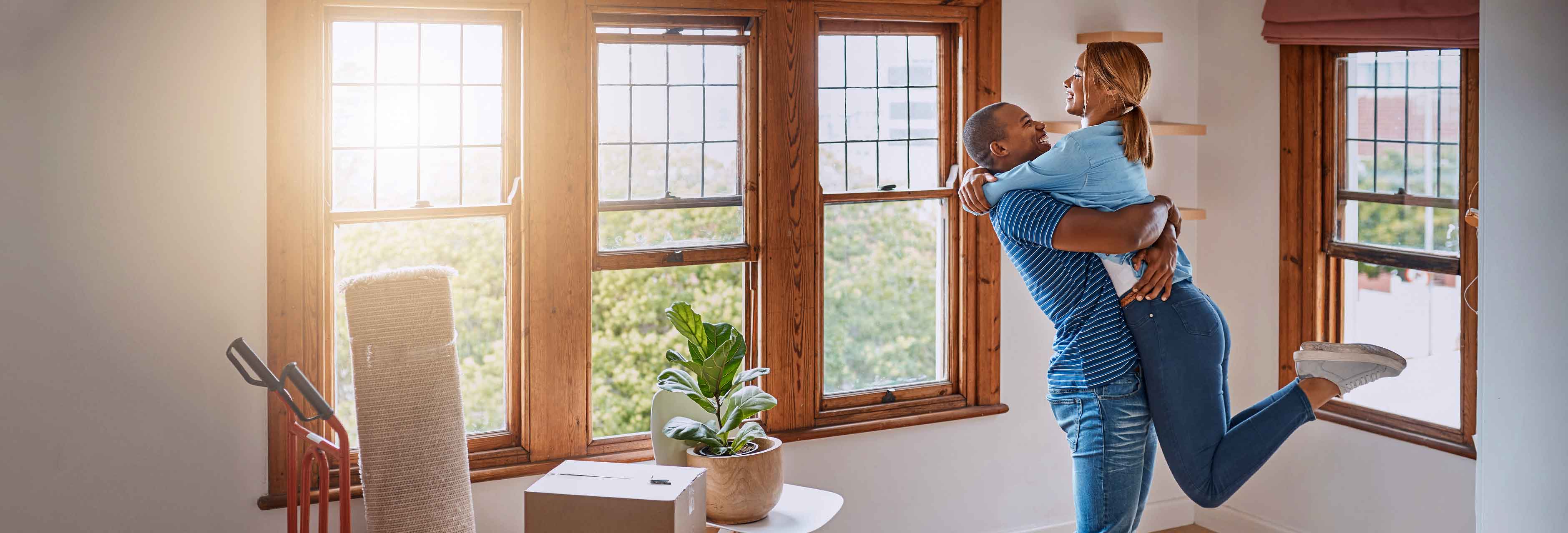 Loving young couple celebrating their new home
